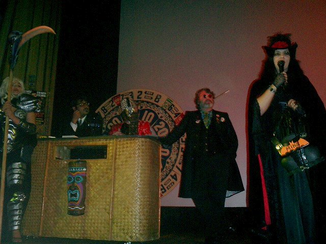 Monica, Mr. Lobo (www.cinemainsomnia.com), El Thrillermo, and Doktor Goulfinger (www.goulfinger.com) relax at the tiki bar as Vampiress Mina Harker (www.sfvampiretour.com) casts her curse on the crowd, 10/7/04