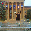 Monica at the top of the steps of the Philadelphia Museum of Art, a la Rocky